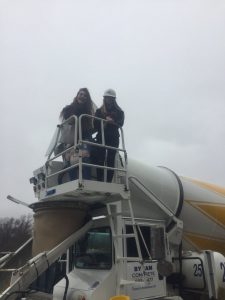 two students on a cherry picker
