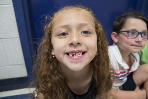 a little girl smiled big