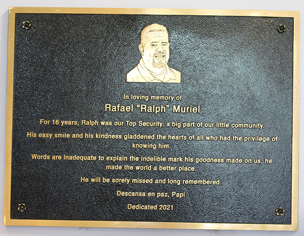 A plaque hangs on the wall.