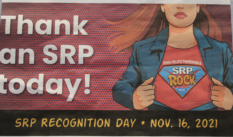 A drawing of a woman pulling open her buttondown shirt to reveal another with a superman type logo that says SRPs Rock. Thank an SRP today!