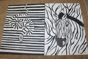 Two drawings done in black and white. The one on the left is a snake and th eone on the right is a zebra.