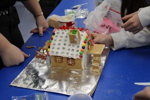 The back of one of the gingerbread houses shows steps to a porch.