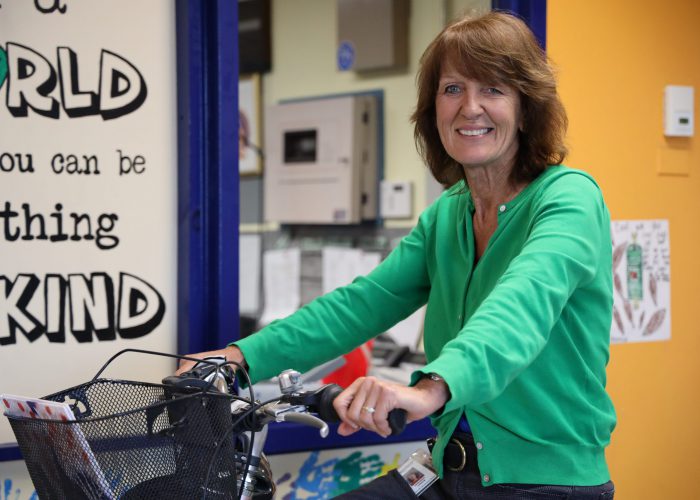 Photo of Golden Hill Principal Lisack on a bike.