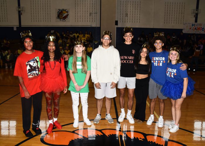 Two students from each high school class pose for a photo at pep rally