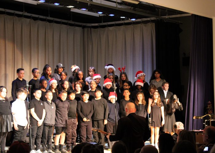 Students singing on stage