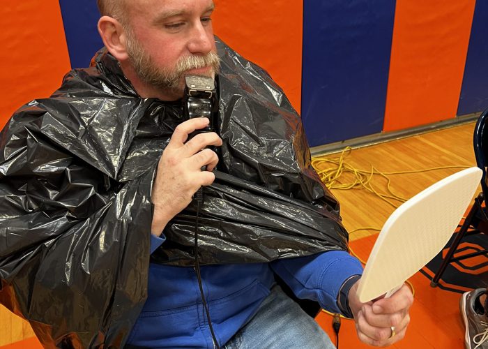 Teacher shaving his beard