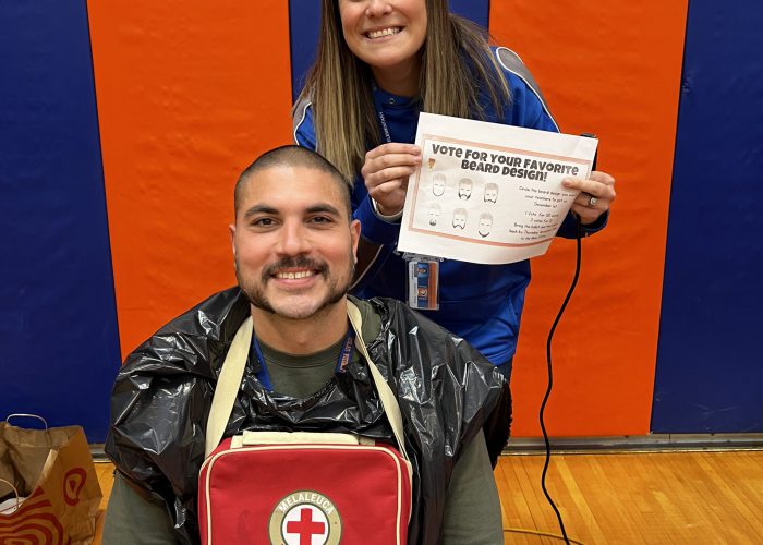 Teachers pose during No Shave November Event