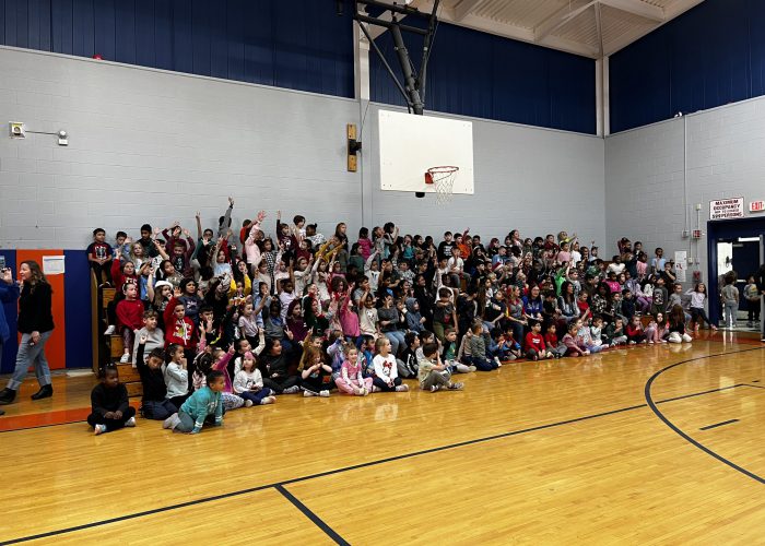 Students cheering in bleachers