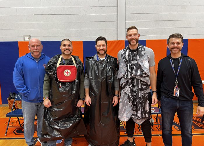 Teachers pose after beards have been shaved for No Shave November event