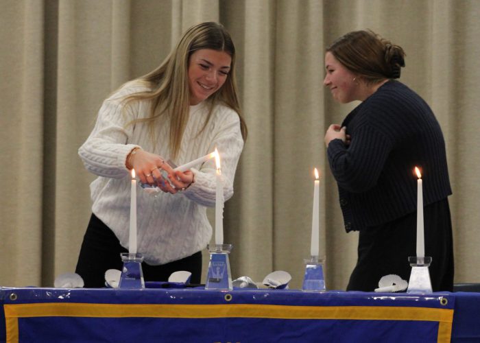 Students lighting candels