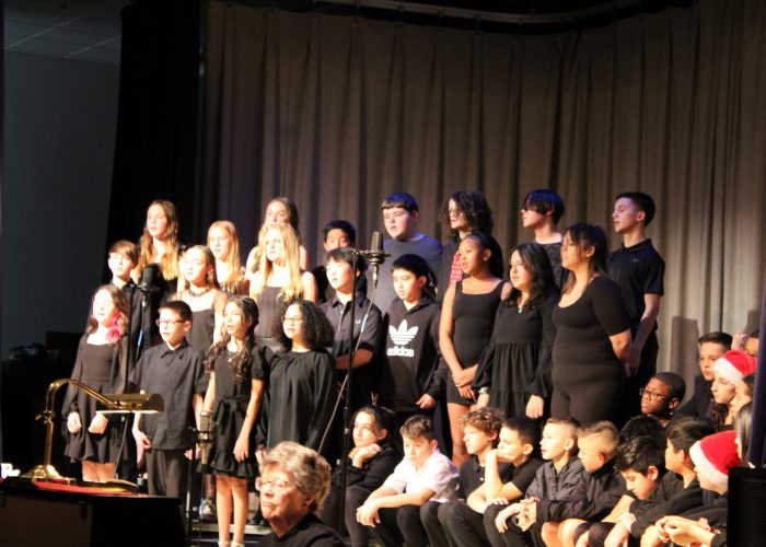 Students singing on stage