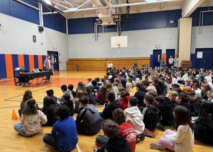 Students watching teacher presentation