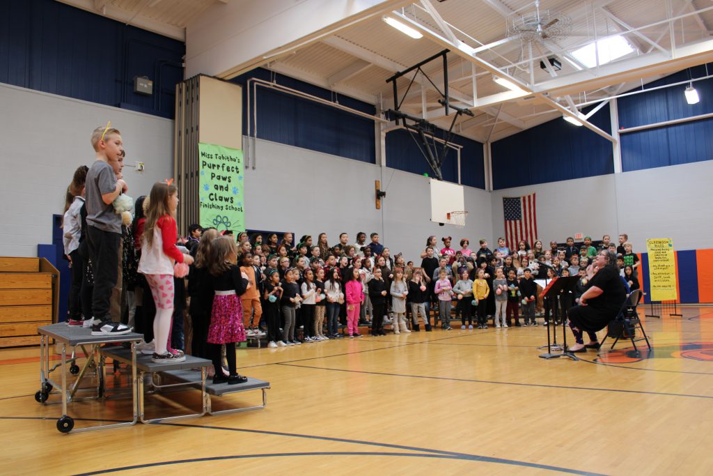 Students standing performing a musical