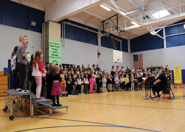 Students standing performing a musical