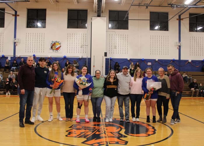 Seniors and their families pose for a photo