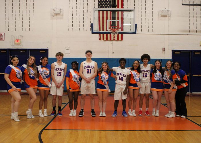 Senior athletes pose for photo in gymnasium