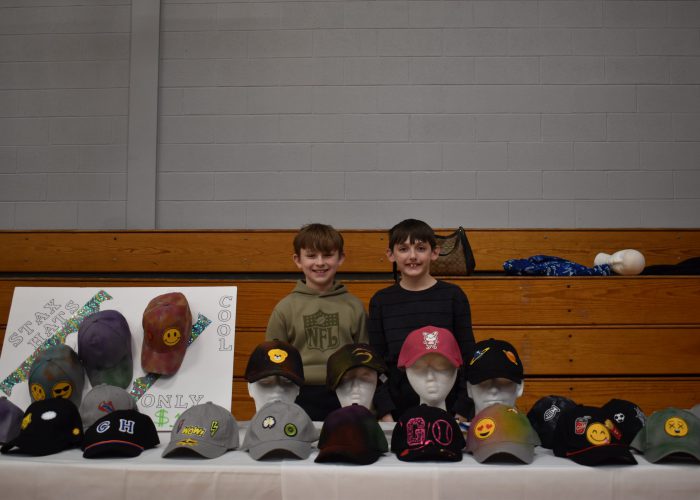 Max Althiser and Stefan Yurchuk sell hats at TREP$