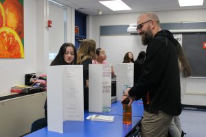 Principal Maesano speaks with students at mock career fair