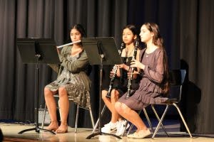 three students play flute and clarinet at 2023 Coffee House Concert