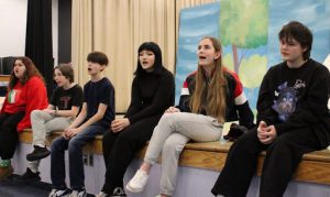 Students sing at rehearsal for play