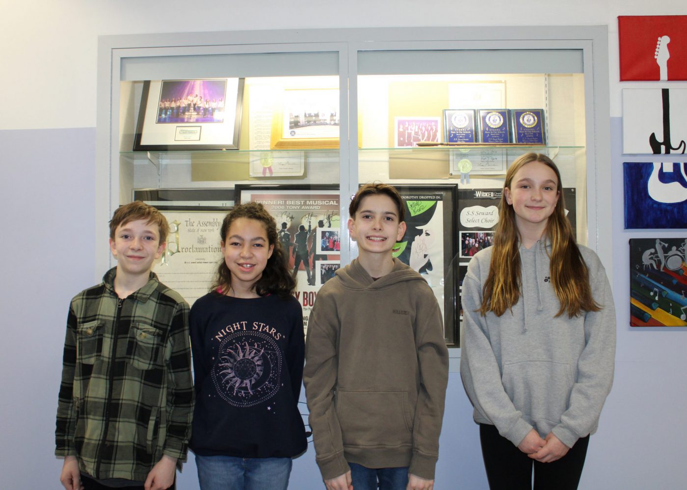 (L-R) Riley Maesano and Linda Higgins (Elementary Chorus) and Tyler Fleury and Caroline Maher (Junior High Chorus)