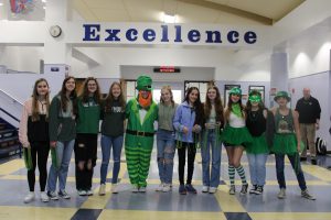 Student council poses for a photo before their classmates enter for the rock paper scissors tournament