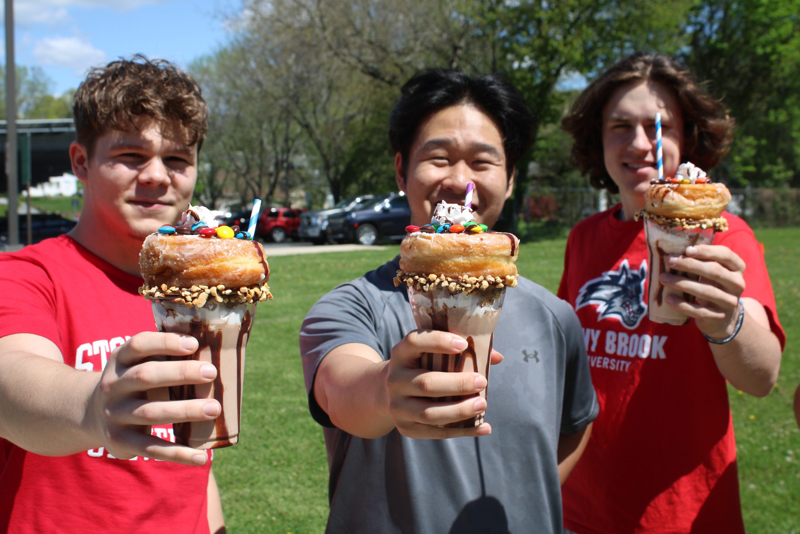 students pose with milkshakes