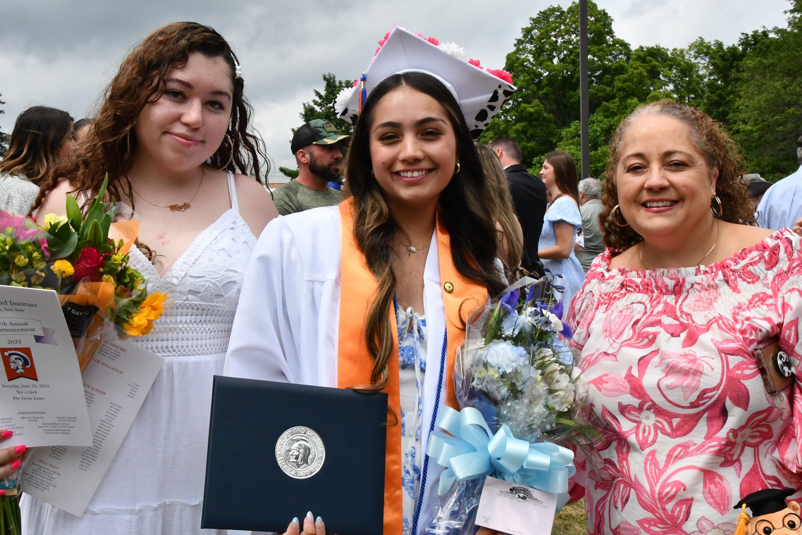 family poses with graduate