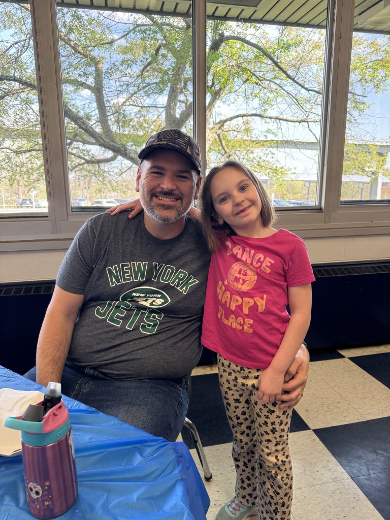 Student poses with her dad